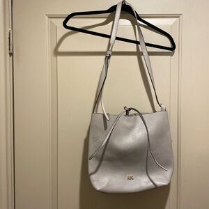 Michael Kors, leather tote purse with snap closure.